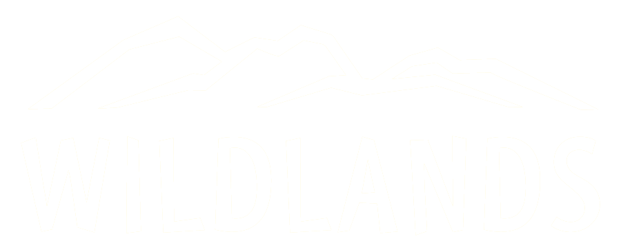 2025_Wildlands_logo-White Wildlands Festival logo
